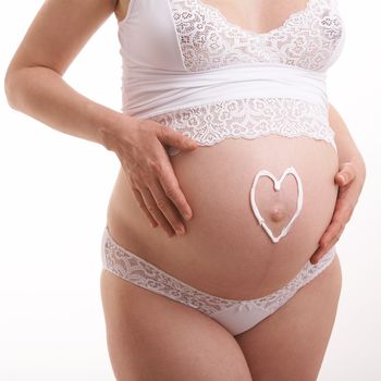 love symbol on the expectant mother stomach