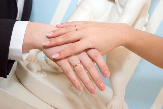 Married couple shows off rings.wedding ring 