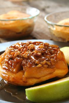 An upside down Apple Caramel Biscuit dessert with 
fresh green apples.