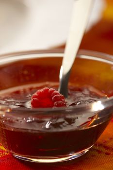 tasty red raspberry jam in a glass bowl