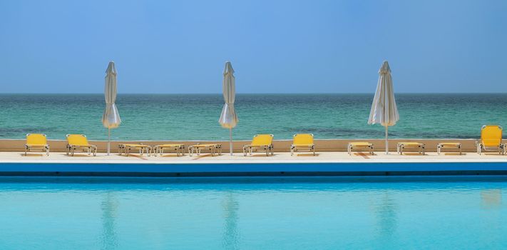 sunny day on a swimming pool, beach view background 