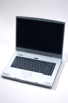 opened  silver laptop computer over gray 