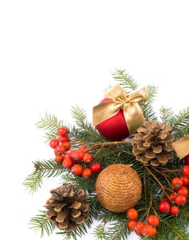 Red glass balls with nice golden ribbons, sparkling candle, rowan and fresh spruce on white background