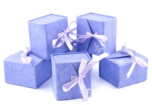 Six small lilac giftboxes on white background