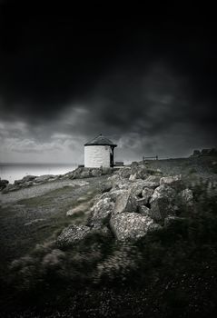 Dark stormy clouds and strong wind by the ocean