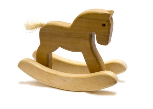 Classic homemade wooden rocking horse on white background.