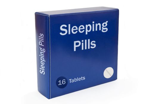 Close and low level angle capturing a blue medication pack with the words "Sleeping Pills" arranged over white.