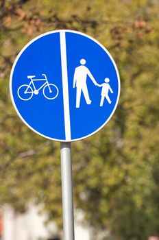 Give way, pedestrian and bycicle crossing sign.