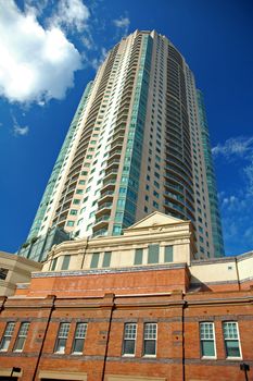 high skyscraper, blue sky, glass windows, photo taken in sydney