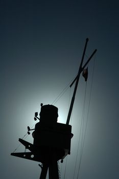 ship mast silhouette, grey blue sky, australian flag