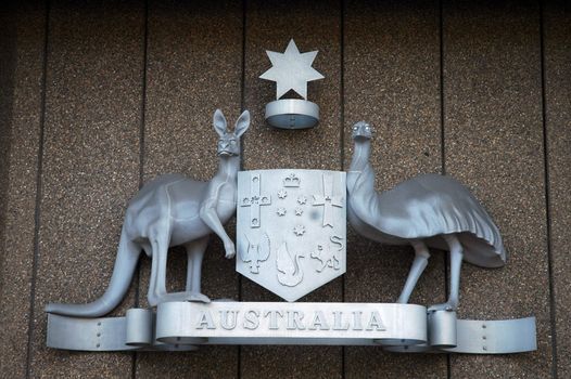 australian government logo made of steel, kangaroo and peafolw