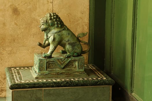 green lion sculpture, chinese architecture, the lion is guarding entrance