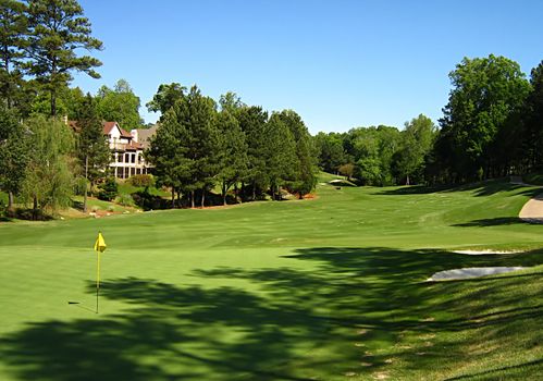 A photograph of a golf course in the afternoon.