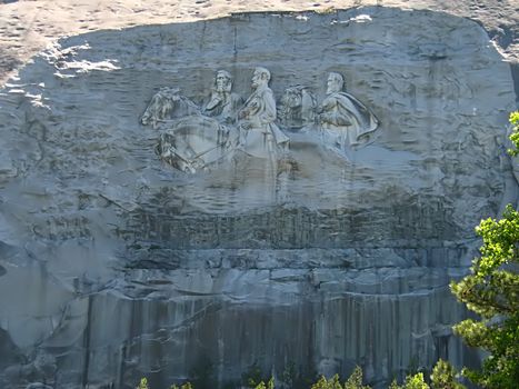 A photograph of the sculpture at Stone Mountain located near the city of Atlanta
in the state of Georgia in the United States. 
This carving is the largest bas relief sculpture in the world and shows Jefferson Davis 
(president of the U.S. Confederacy circa 1861 - 1865) and Confederate Generals Robert E. Lee 
and Thomas Jonathan "Stonewall" Jackson.