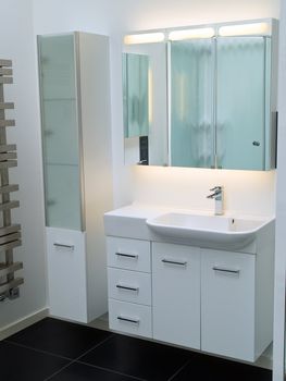 Details of a modern trendy contemporary designer bathroom in all white elements