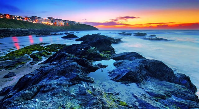 Sunset by the ocean in Newquay, Cornwall, UK 

