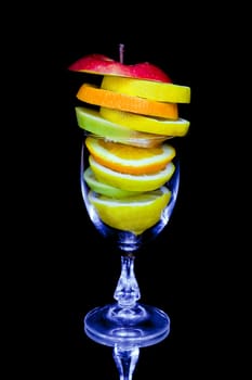 Fruit cocktail composition isolated on black background
