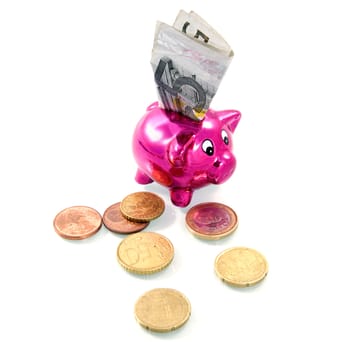 five euro banknote in a pink piggybank
