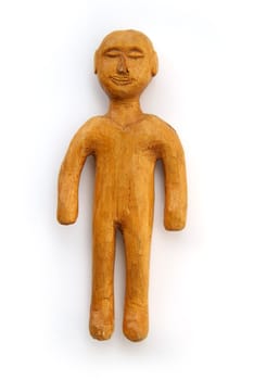 small carved man figure on white background