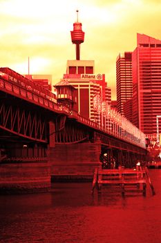 Darling Harbour, colored picture, tran on Pyrmont bridge, sydney tower in background