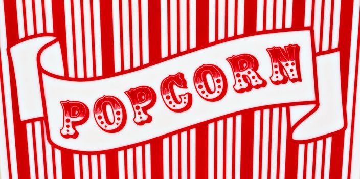 Red and white popcorn sign on red and white striped background