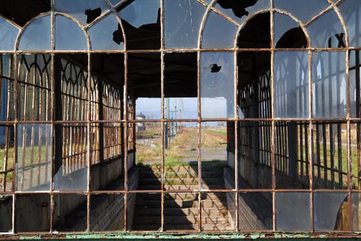 Broken window of the old abandoned railway station
