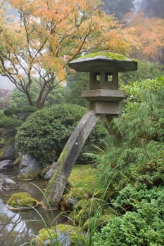 Stone Lantern by the Pond in Japanese Garden