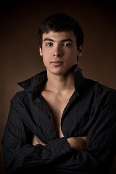 portrait of a young man with unbuttoned shirt