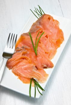 smoked salmon on white dish
