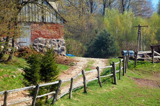 Cottage house and road on the farm
