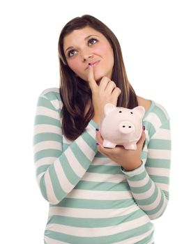 Pretty Ethnic Female Daydreaming and Holding Pink Piggy Bank Isolated on a White Background.
