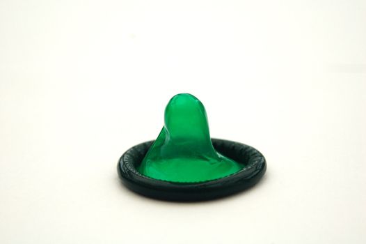 Bright Green Condom on White Background