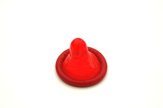 Bright Red Condom on White Background