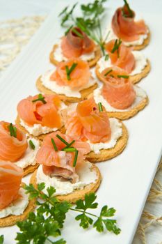 Canape with Salmon on white dish