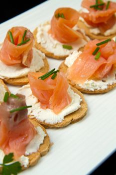 Canape with Salmon on white dish