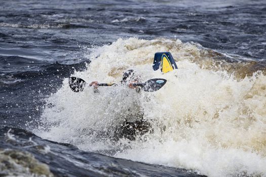 Kayak freestyle on whitewater