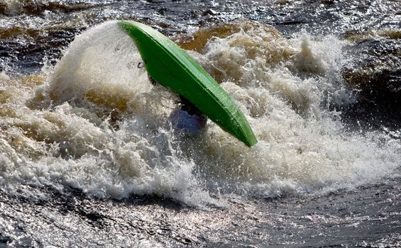 Kayak freestyle on whitewater