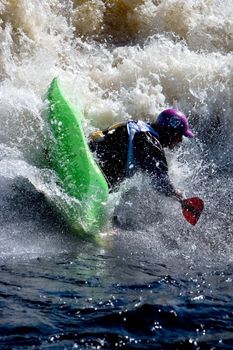 Kayak freestyle on whitewater