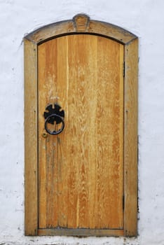 Vintage wooden door in ancient monastery of Suzdal, Russia