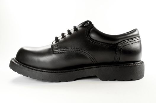 High resolution image of an isolated black leather shoe.