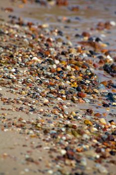 Close up of rounded and polished beach rocks
