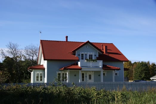 The modern house on a background of clouds