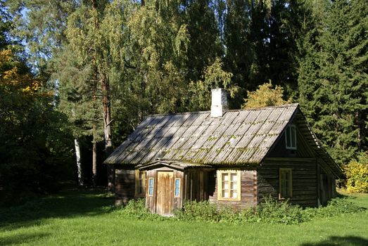 The old wooden house is near to trees