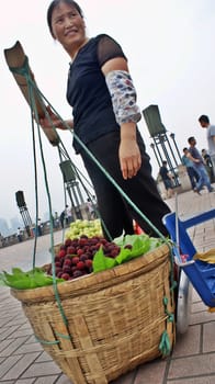 CHINA, CHONGQUIN PEOPLE SELLING FRUITS ON THE STREETS