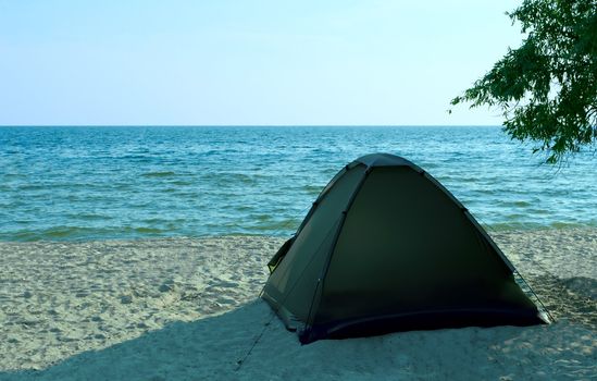 Tent on the solitude beach. Kinburn Spit, near Ochakiv, Ukraine
