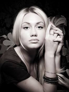 Portrait of a young blond model with sexy look