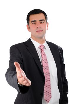 Portrait of a young businessman in a dark suit ready to handshake isolated on white
