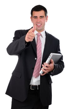 Portrait of a confident young businessman in a dark suit holding laptop isolated on white