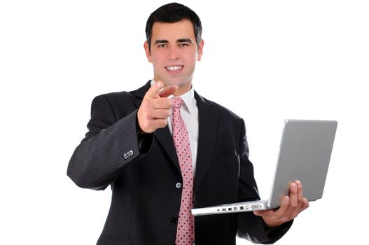 Close up of young businessman holding laptop pointing finger forward