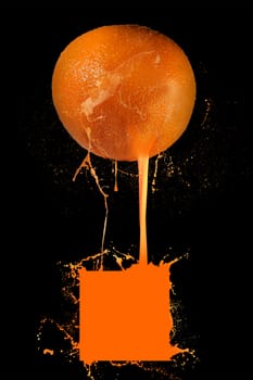 Orange in splashing juice on black background